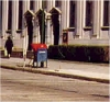 Red-and-blue USPS mailboxes